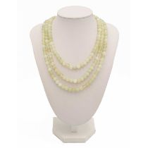 A green hardstone necklace, with 9ct gold clasp.