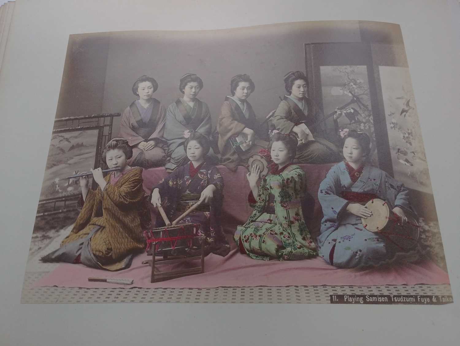 A Japanese hand coloured photo album with lacquer cover, Meiji period. - Image 44 of 52