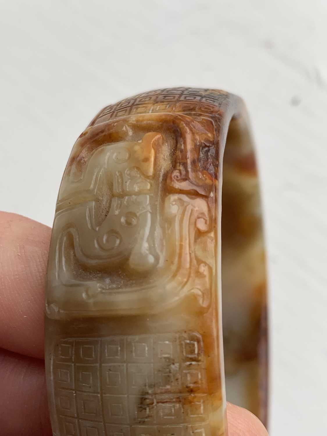 A Chinese carved jade bangle, probably Neolithic period. - Image 29 of 30