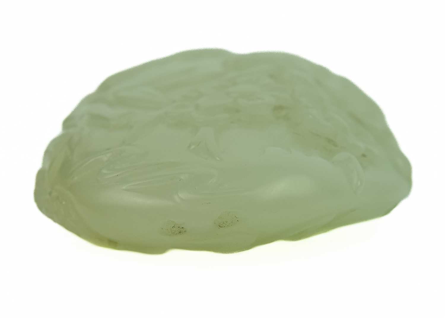 A Chinese pale celadon carved boulder. - Image 4 of 6