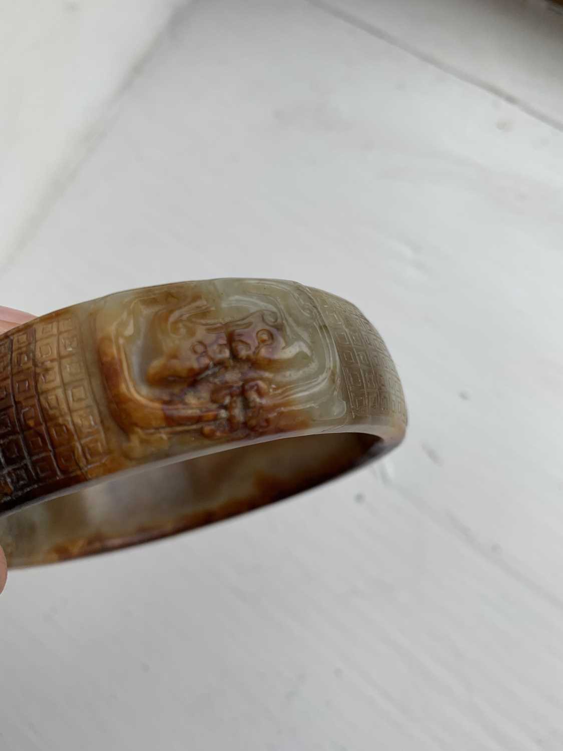 A Chinese carved jade bangle, probably Neolithic period. - Image 9 of 30