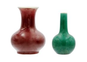 A Chinese dark green monochrome crackle-glaze bottle vase, 19th century.