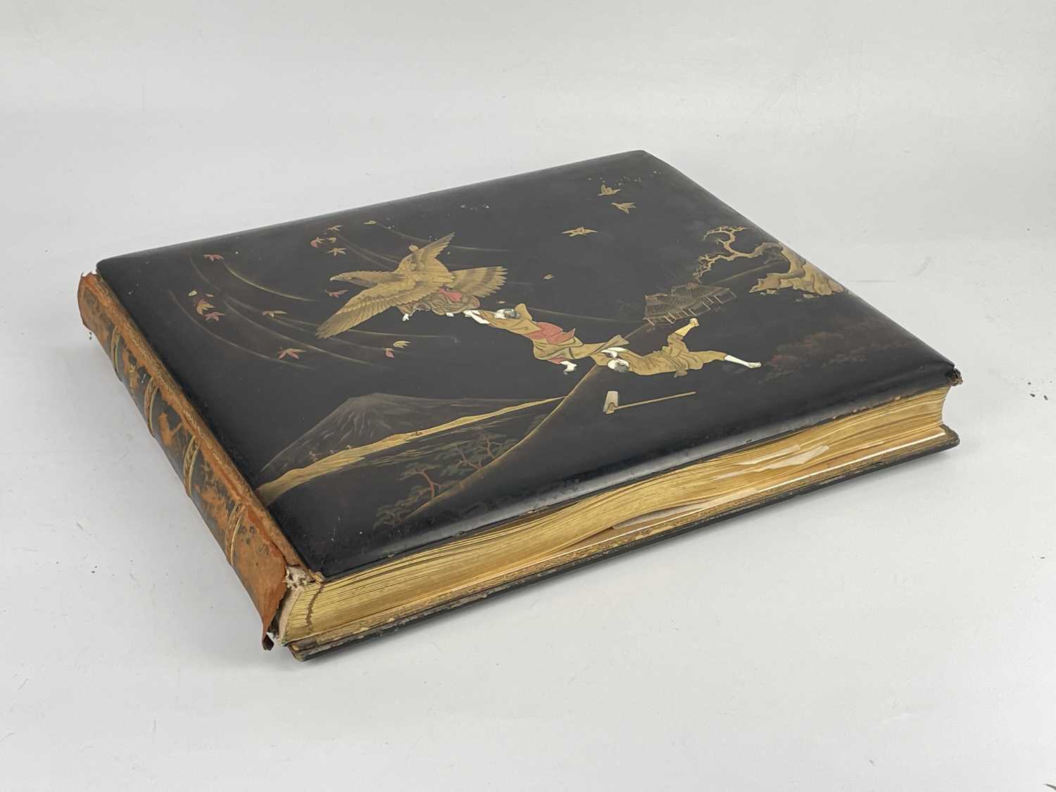 A Japanese hand coloured photo album with lacquer cover, Meiji period. - Image 7 of 52