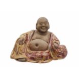 A Chinese pottery model of Buddha, 18th/19th century.