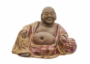 A Chinese pottery model of Buddha, 18th/19th century.