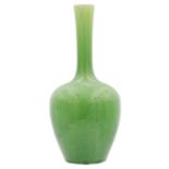 A Chinese green glazed monochrome bottle vase, Qing Dynasty, 19th century.