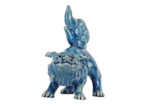 A Chinese turquoise glazed pottery 'Lion' dog, late Qing Dynasty, circa 1900.