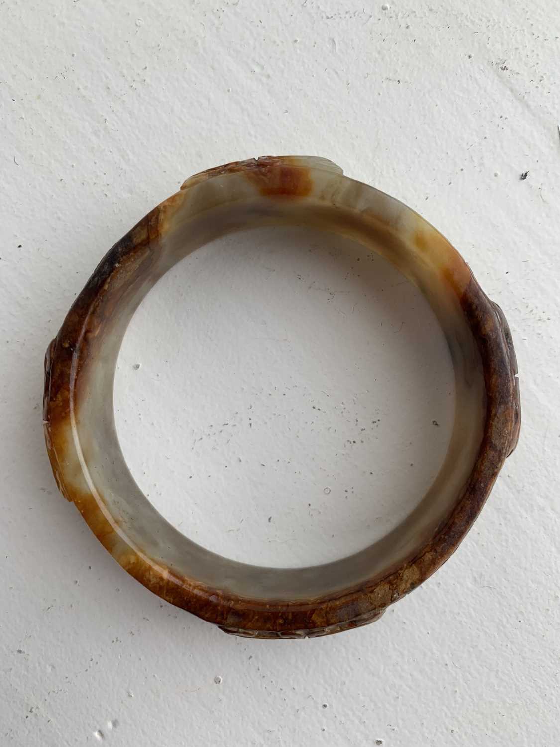 A Chinese carved jade bangle, probably Neolithic period. - Image 19 of 30