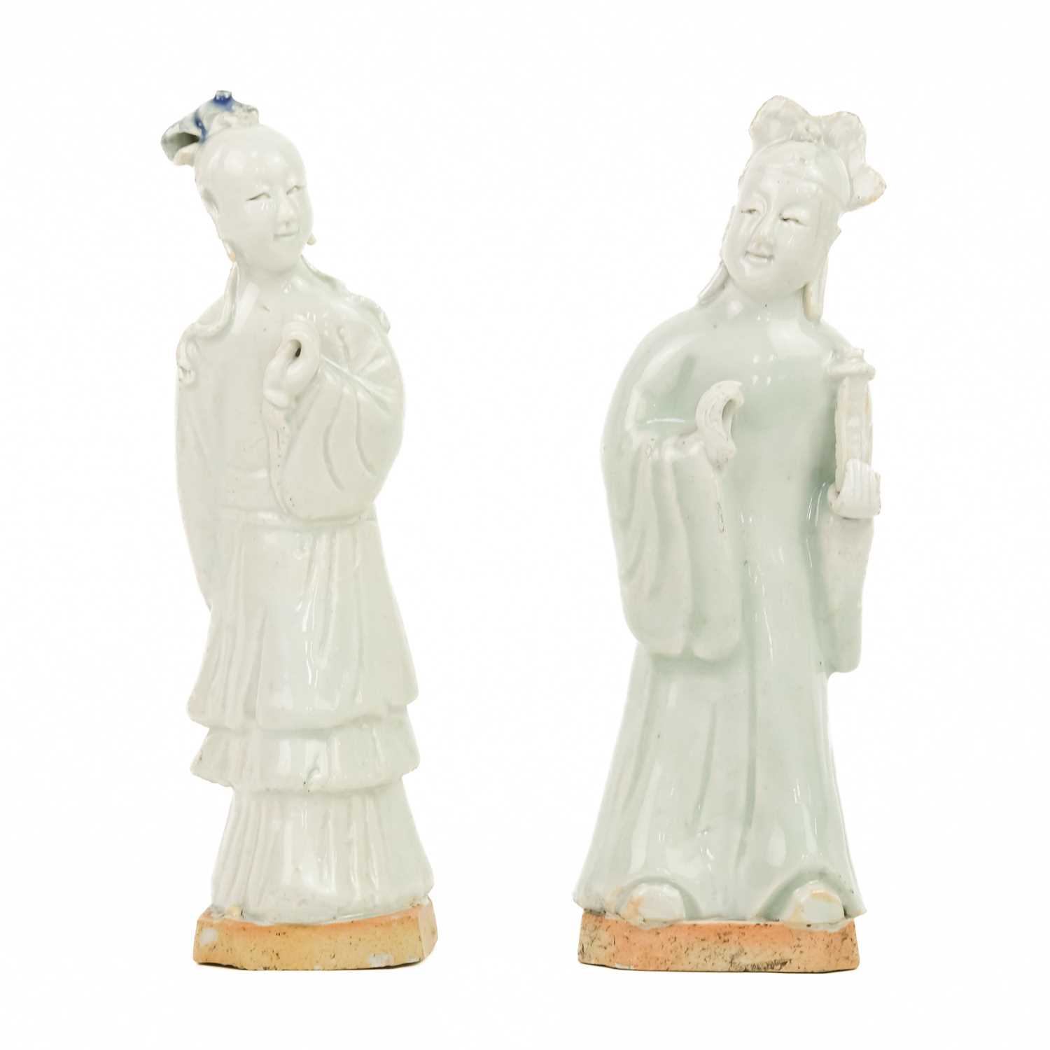 A pair of Chinese celadon figures of attendants, 19th century.