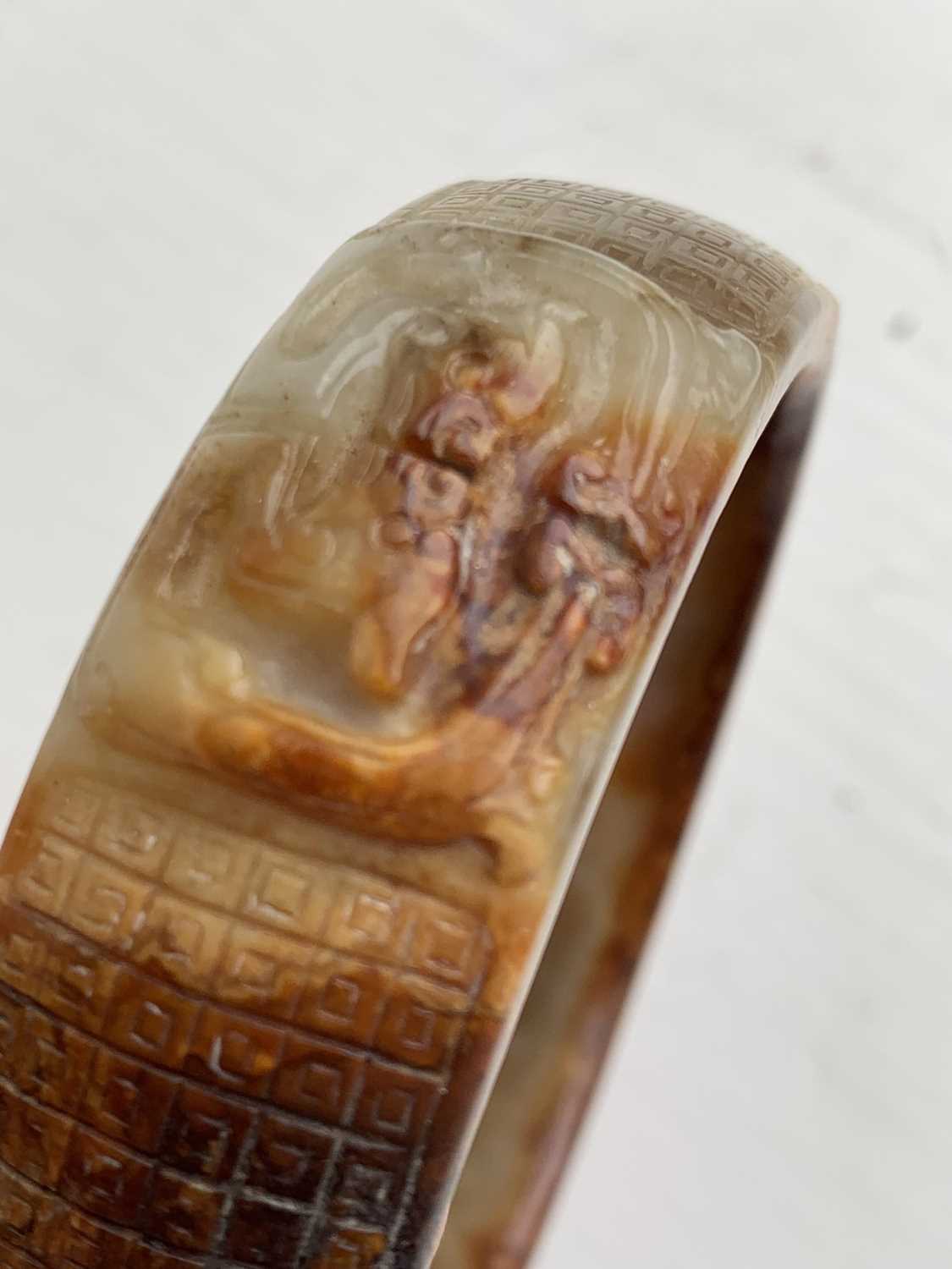 A Chinese carved jade bangle, probably Neolithic period. - Image 16 of 30