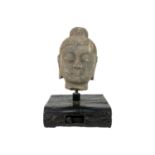 A carved stone Buddha head.