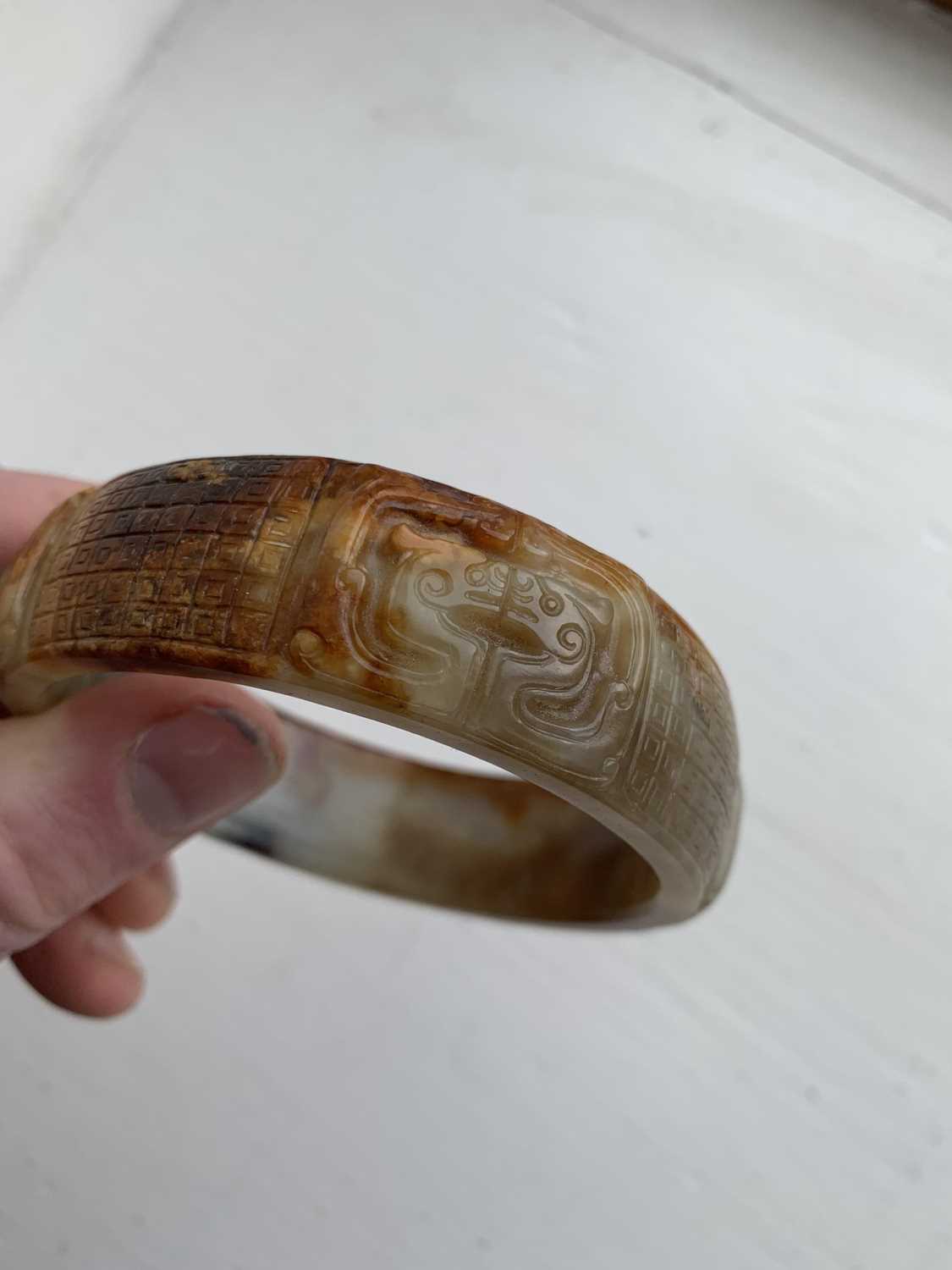 A Chinese carved jade bangle, probably Neolithic period. - Image 30 of 30