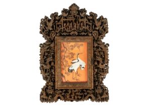 A Chinese carved wood photo frame, early 20th century.