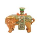 A Chinese Canton famille rose 'elephant' candlestick, Qing Dynasty, 19th century.