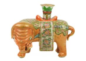 A Chinese Canton famille rose 'elephant' candlestick, Qing Dynasty, 19th century.