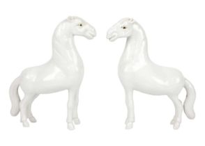 A pair of Chinese porcelain models of horses, possibly 18th/19th century.