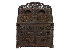 A Chinese carved hardwood bureau, Qing Dynasty, 19th century.