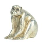A Japanese silver okimono of a macaque, signed.