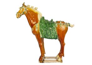 A large Chinese Tang style sancai model of a horse.