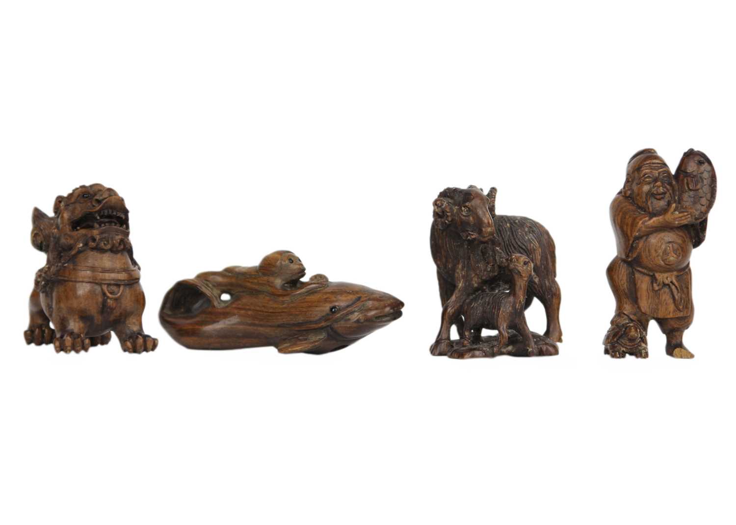 A collection of eleven Japanese carved wood netsukes, 20th century. - Image 3 of 5