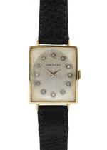 LONGINES - A 14ct rectangular cased lady's manual wind wristwatch with diamond set dial.