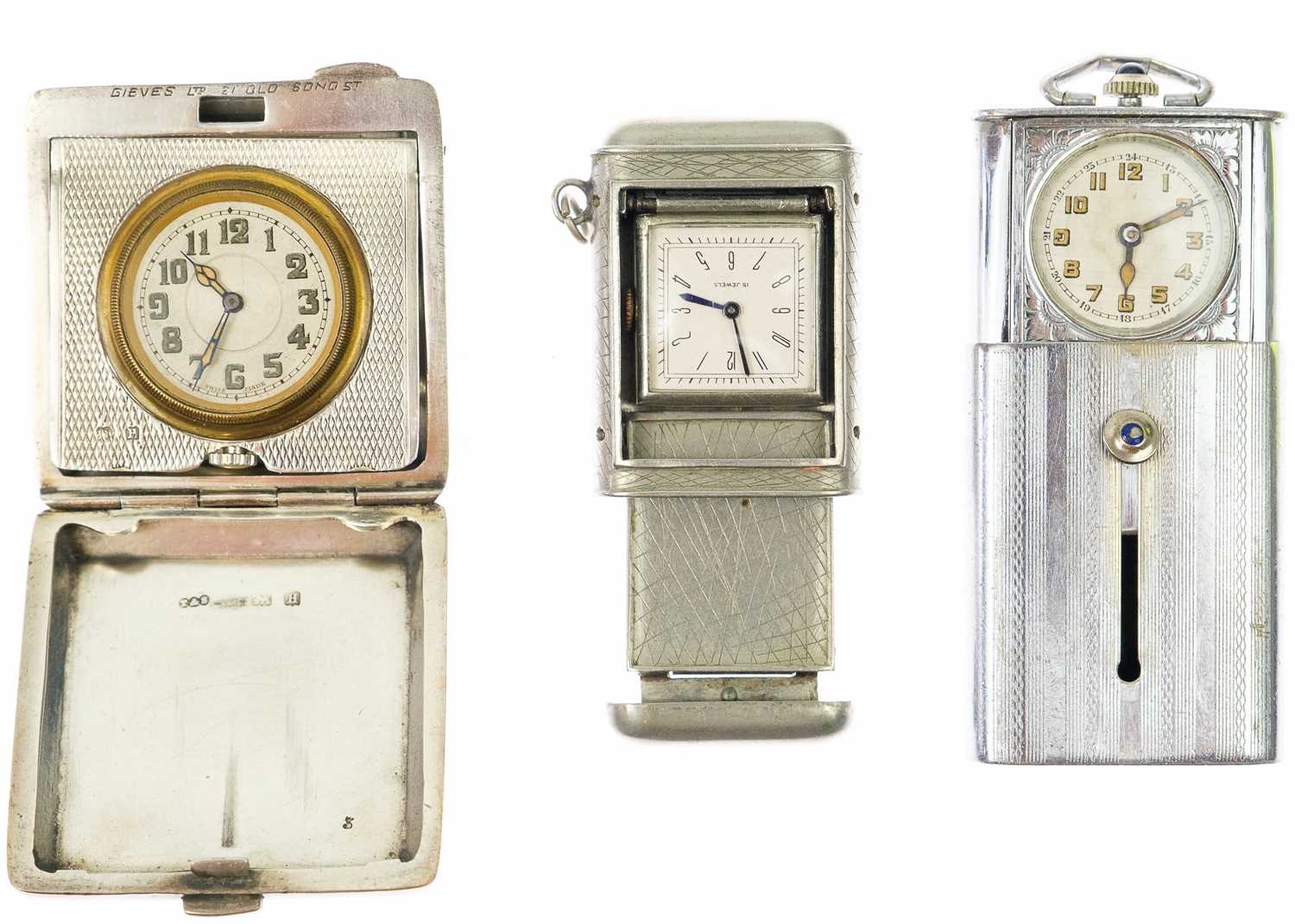 A selection of three purse watches.