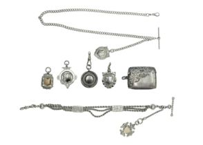 A selection of silver pocket watch accessories.