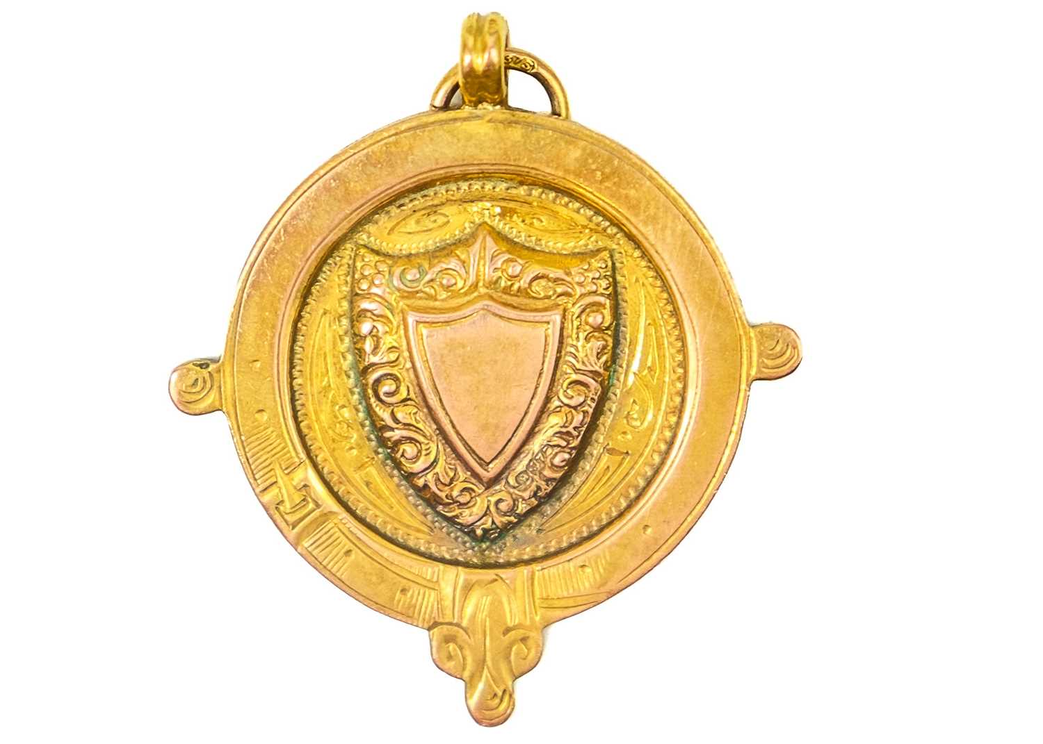 A 9ct gold shield fob.