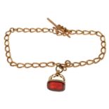 A 9ct rose gold Albert watch chain with rose gold carnelian seal fob.