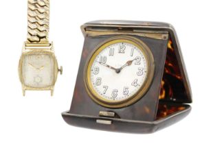 A Bulova gold-plated manual wind gentleman's wristwatch and a travel clock.