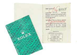 A Rolex Air King model 1023 guarantee and a Rolex Oyster booklet.