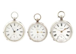 Two silver Waltham key wind lever pocket watches, and one other.