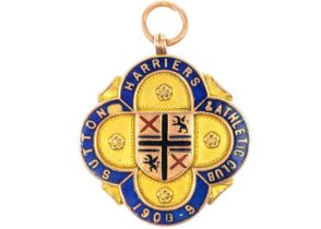 An Edwardian 9ct rose gold and enamel shield watch fob by Vaughton Birmingham.
