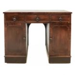 A George III mahogany kneehole desk.