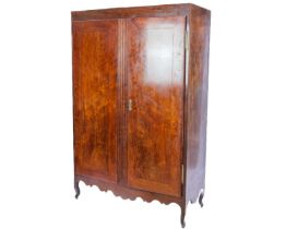 An early 20th century French fruit wood wardrobe.