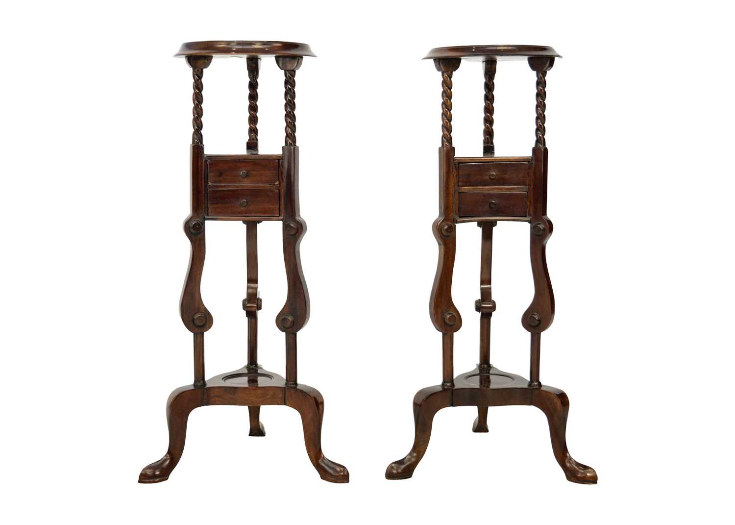 A pair of mahogany gentleman's tripod washstands.