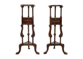 A pair of mahogany gentleman's tripod washstands.