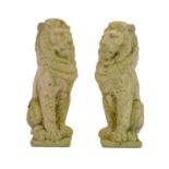 Two reconstituted stone figures of seated lions.