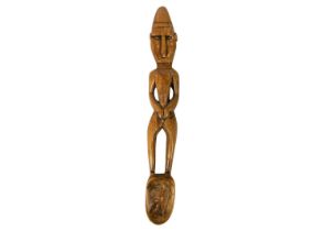 A possible Polynesian wood carved male figural ladle,