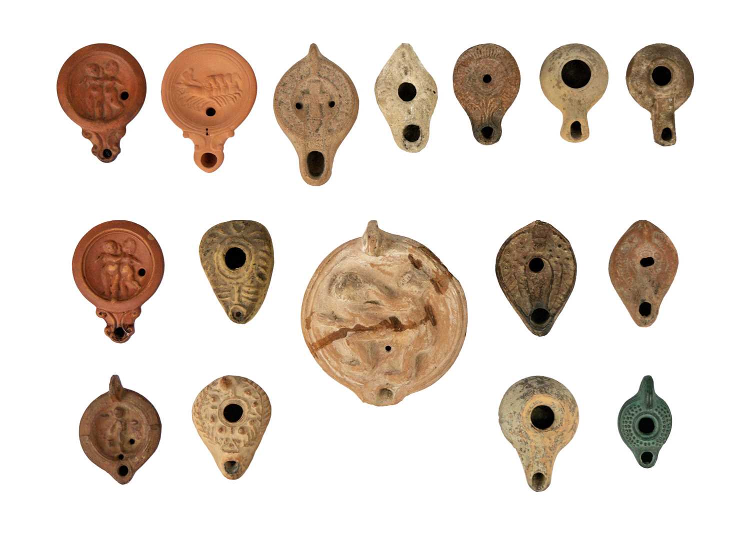 A collection of terracotta oil lamps