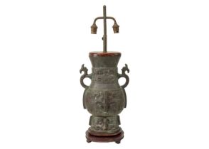 A Chinese Archaic style bronze table lamp.