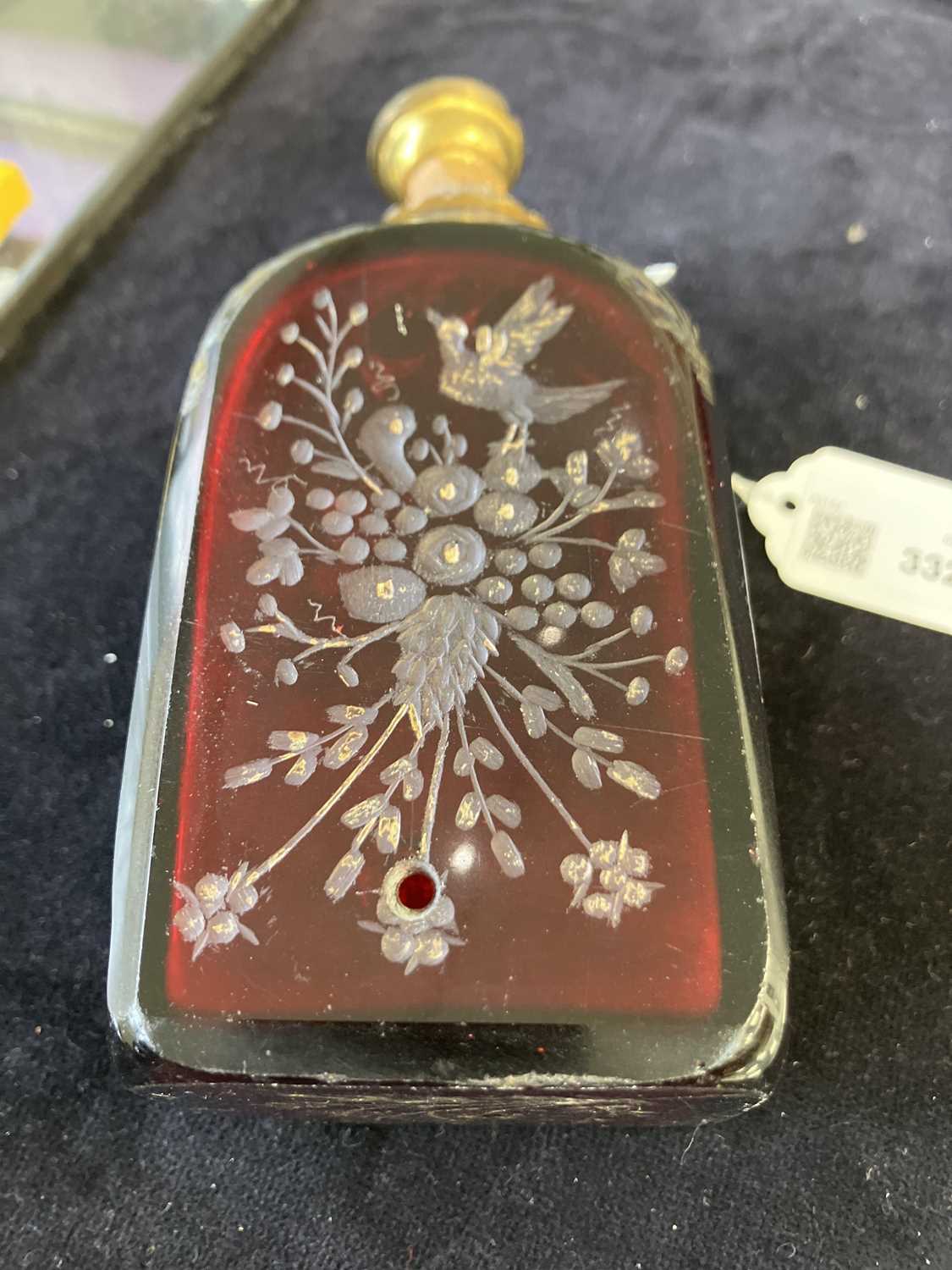 An early 18th century ruby glass decanter, etched with exotic birds, flowers and foliage. - Image 6 of 7