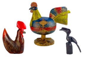 A wood-carved and painted box in the form of a hen.