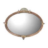 A planished copper oval wall mirror.