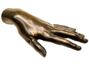A Victorian hollow bronze model of a hand.