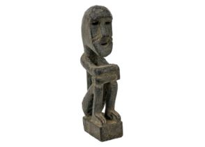 A wood carved ancestor figure.