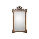 A gilt plaster wall mirror.