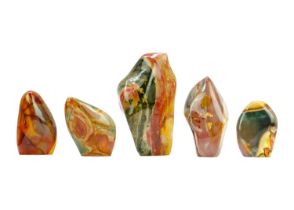 Five polychrome jasper mineral specimens.