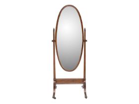 An Edwardian mahogany oval cheval mirror.