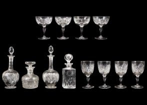 A pair of shaft and globe cut glass decanters and stoppers.